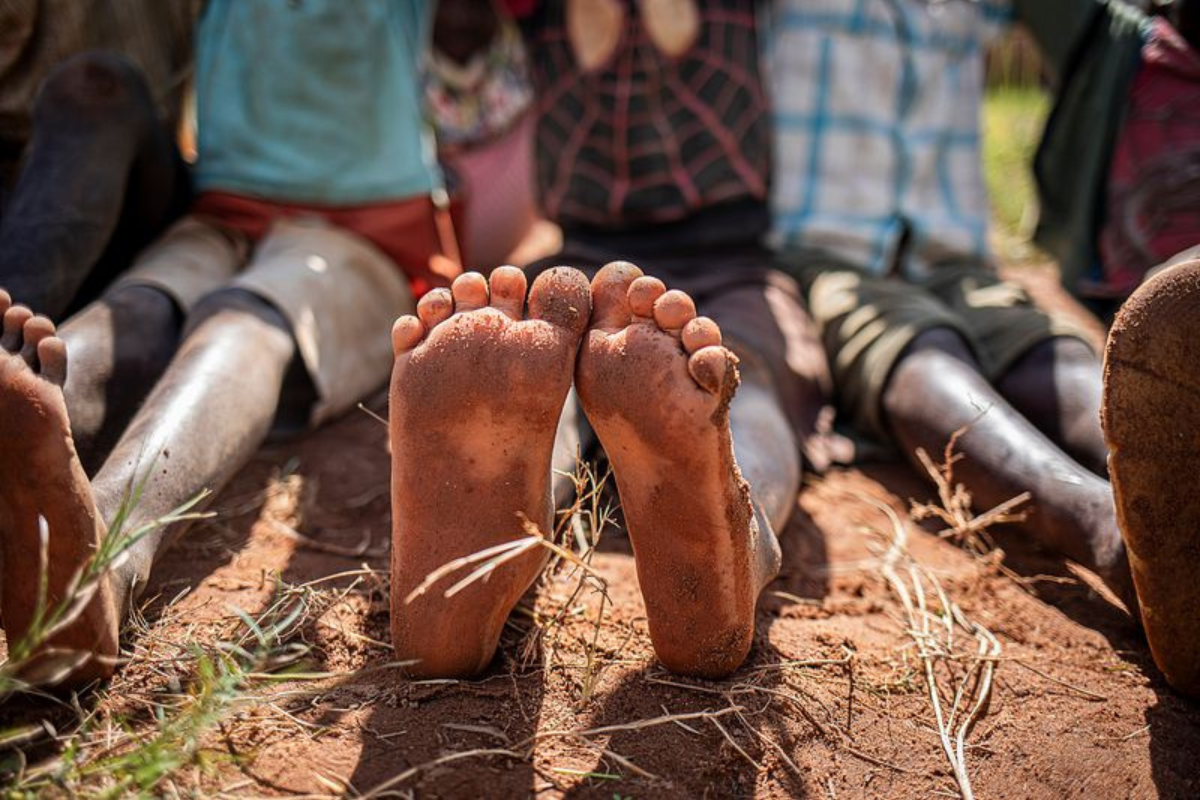 close up of the feet of a child in africa_10